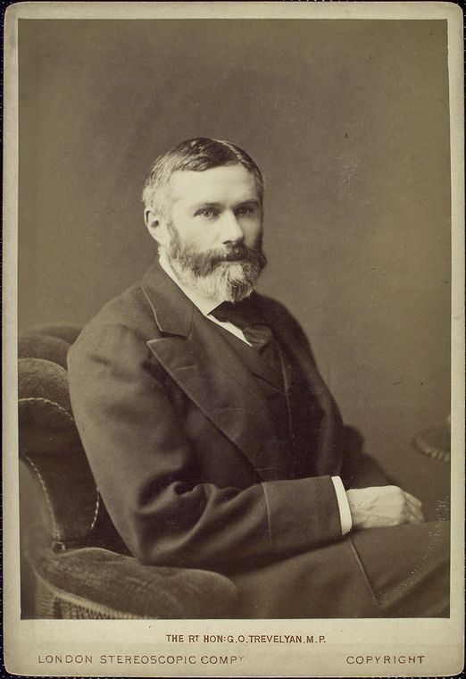 A seated man with a full beard and mustache wears a suit and looks slightly to the side. The image is sepia-toned with a plain background. Text at the bottom identifies the photo as by London Stereoscopic Company.